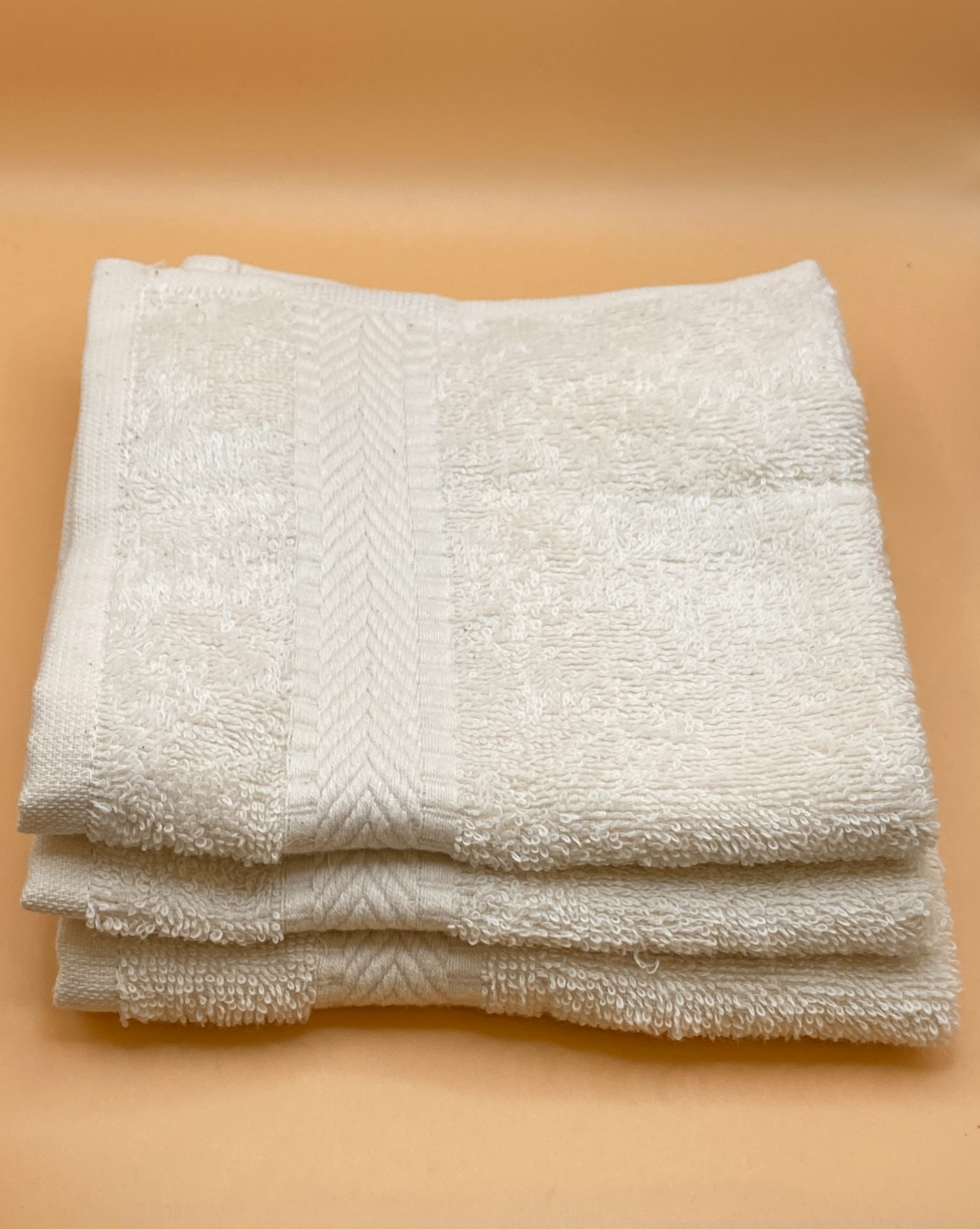 3 face cloth staked on top of each other