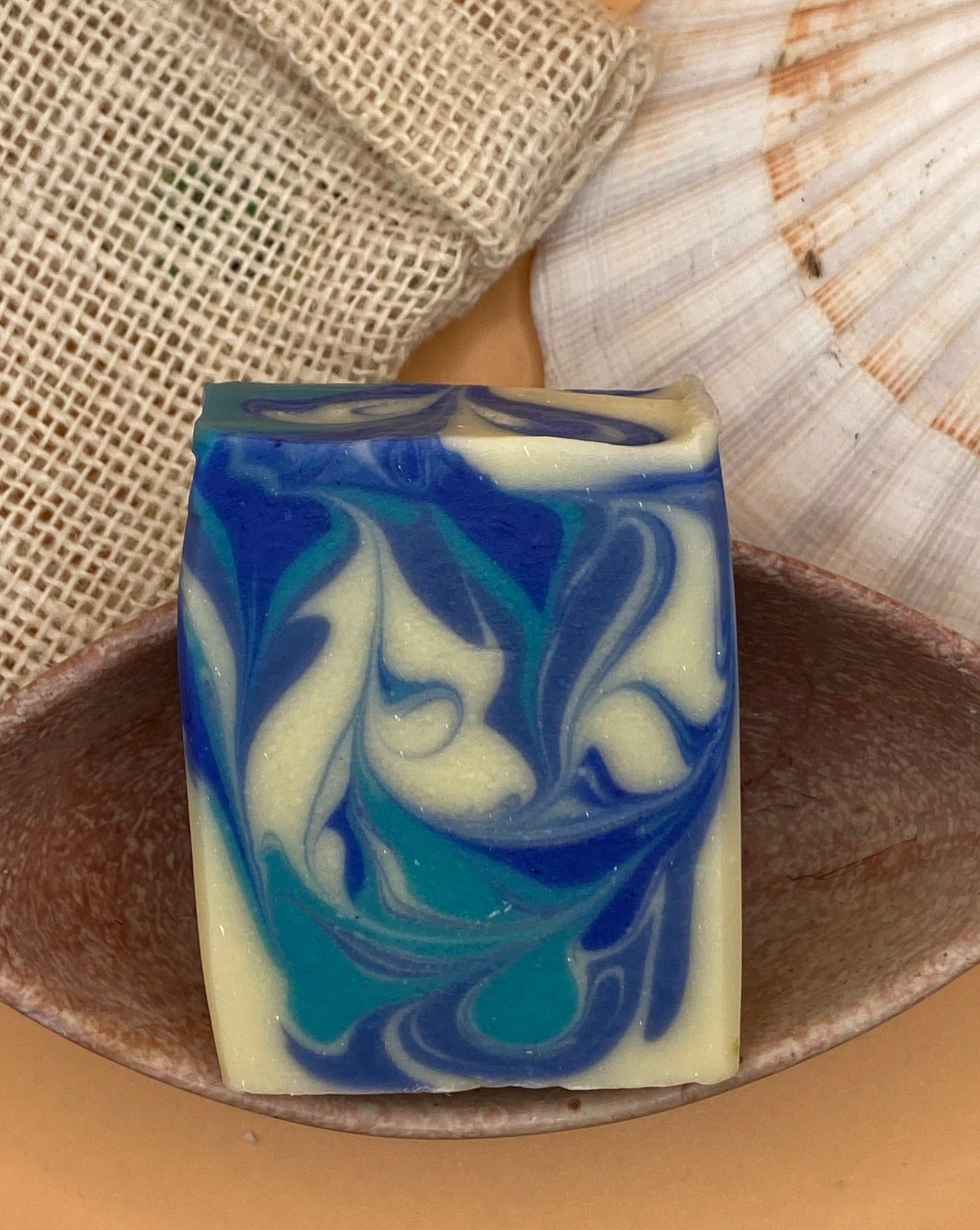 Gone to the beach soap. Hand and body soap with all natural plant oils and butters good for your skin. This soap does not dry out your skin. Beautifully designed with 3 different blue colours in a nice design. It has a nice fresh fragrance reminding one of a scent from the sea.