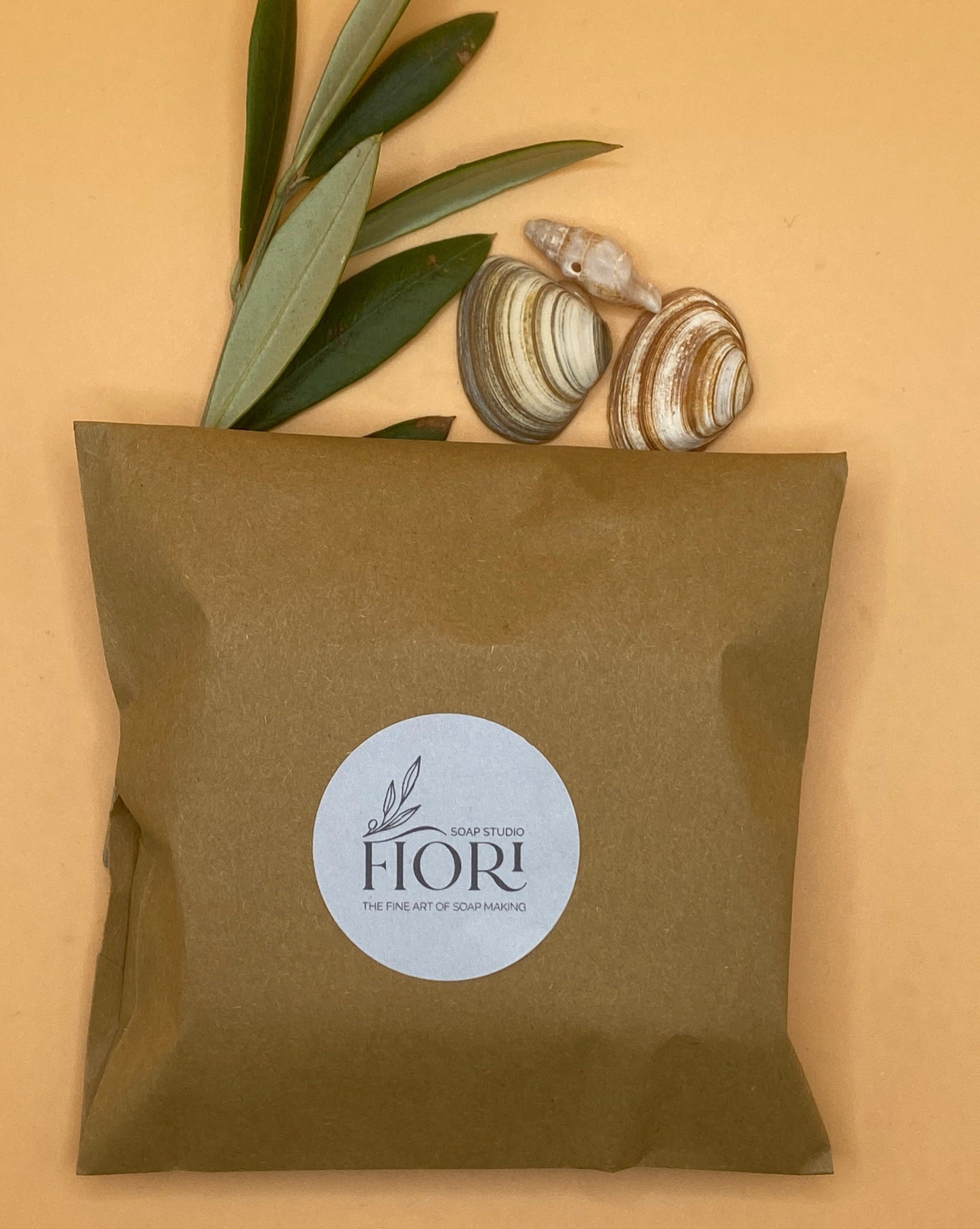 Pink Grapefruit soap wrapped in brown paper bag