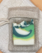 Lade das Bild in den Galerie-Viewer, Ginkgo-Limette Soap laying on a soap saver bag.
