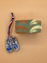 Load image into Gallery viewer, Fig-Vanille Soap with typical Dutch wooden shoes.
