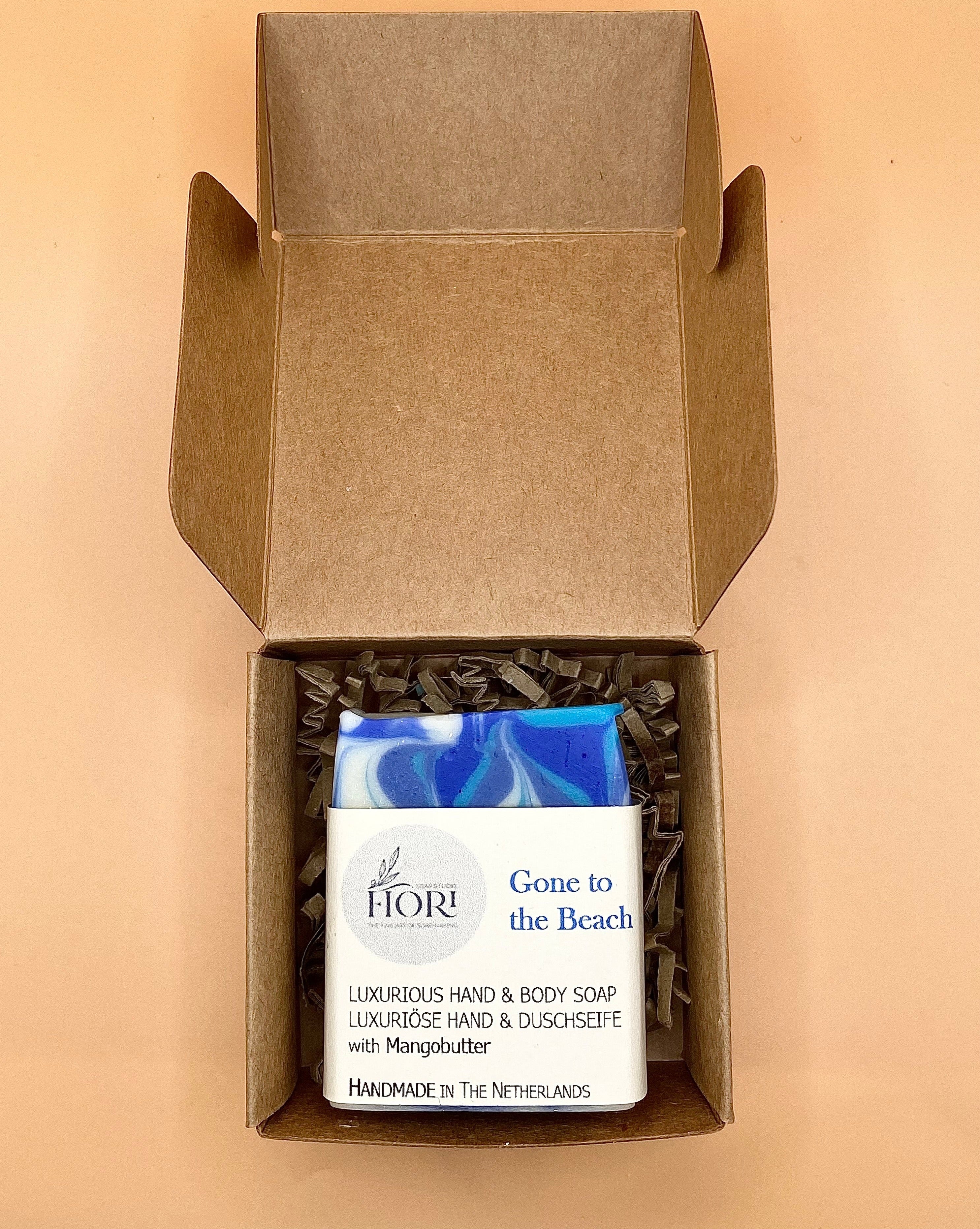 Handmade soap called "Gone to the beach"  is packaged in a Kraft paper box which is one of the 2 packaging options available for online orders. It is a handmade soap with only high quality ingredients. Very good for your skin and with a rich lather. Good for everyday use.