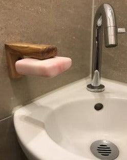 Magnetic soap holder (olive wood) - large with soap over a sink